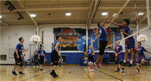 Volleyball play of Glen Crest Spartan spiking ball 
